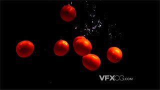 实拍视频新鲜小番茄掉落在黑色幕布背景水槽中形成气泡