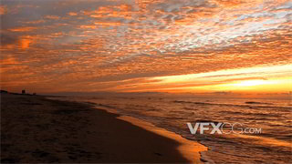 实拍视频落日夕阳将整片天空海洋映照为橘色令人流连忘返