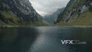 飞行在山川间蜿蜒盘旋的湖水上的实拍视频